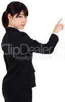 Focused businesswoman pointing