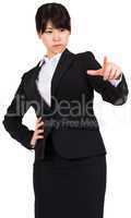 Focused businesswoman pointing