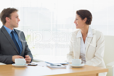 Smartly dressed couple in a business meeting