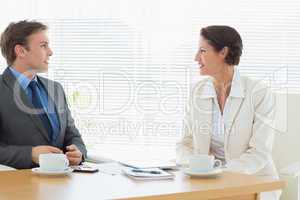 Smartly dressed couple in a business meeting