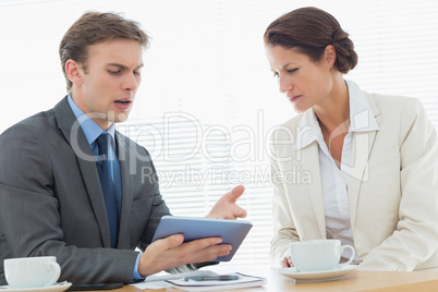 Smartly dressed couple in a business meeting