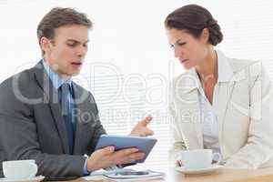 Smartly dressed couple in a business meeting