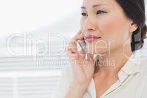 Close-up of a beautiful businesswoman using cellphone