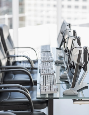 Chairs, computers and headset in modern office