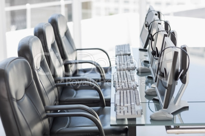 Chairs, computers and headset in a modern office