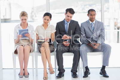 Business people waiting for job interview in office