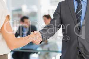 Mid section of handshake to seal a deal after meeting