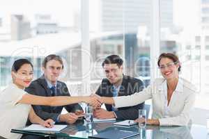 Handshake to seal a deal after a job recruitment meeting