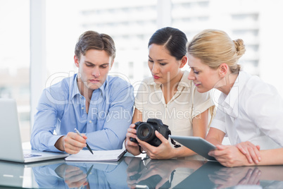 Colleagues working together at desk