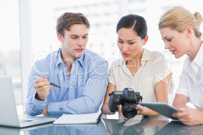 Colleagues working together at desk