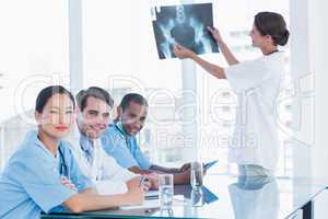 Doctor explaining x-ray to her team