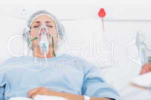 Female patient receiving artificial ventilation