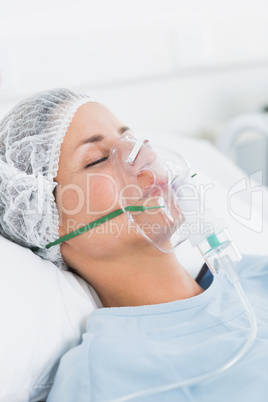 Female patient receiving artificial ventilation