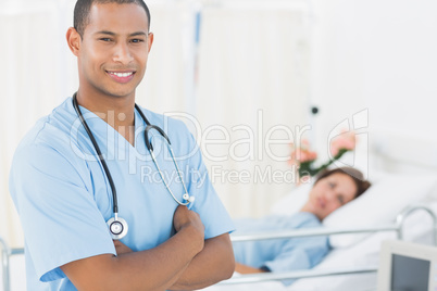 Smiling surgeon with patient in hospital