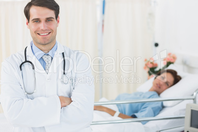 Smiling doctor with patient at hospital