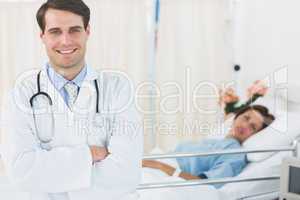 Smiling doctor with patient at hospital