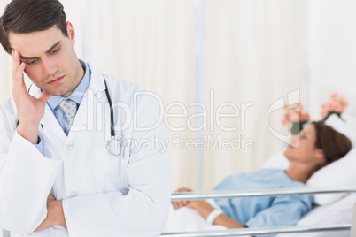 Worried doctor with patient in hospital