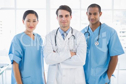 Three doctors standing together at hospital