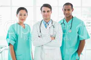 Three doctors standing together at hospital