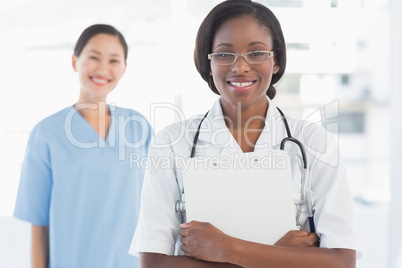 Portrait of a confident doctor and surgeon with report