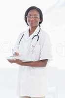 Portrait of a smiling female doctor with report