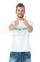 Portrait of a happy male volunteer gesturing thumbs up