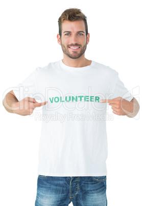 Portrait of a happy male volunteer pointing to himself