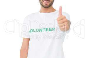 Close-up of a happy male volunteer gesturing thumbs up