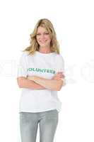 Portrait of a happy female volunteer with arms crossed