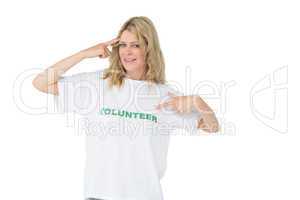 Portrait of a happy female volunteer pointing to herself