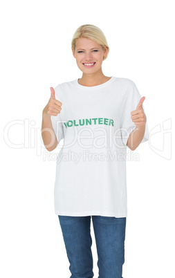 Portrait of a happy female volunteer gesturing thumbs up