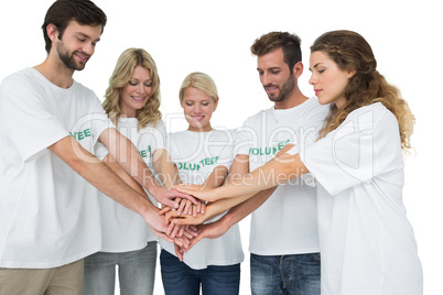 Group of young volunteers with hands together