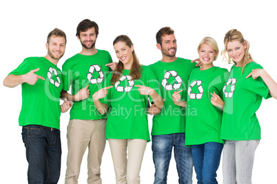 People in recycling symbol t-shirts pointing to themselves