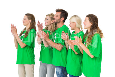 People in recycling symbol t-shirts clapping hands