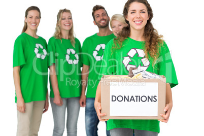 People in recycling symbol t-shirts with donation box