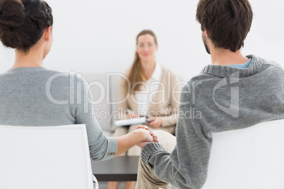 Blurred financial adviser in meeting with couple