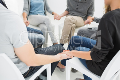 Group therapy in session sitting in a circle