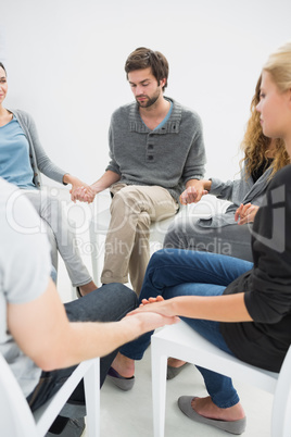 Group therapy in session sitting in a circle