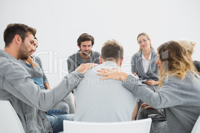 Group therapy in session sitting in a circle