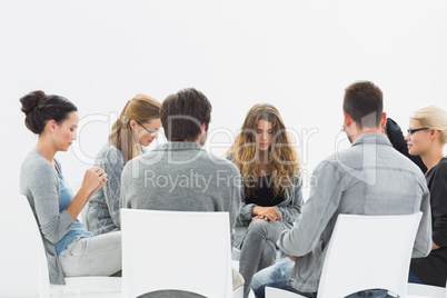 Group therapy in session sitting in a circle