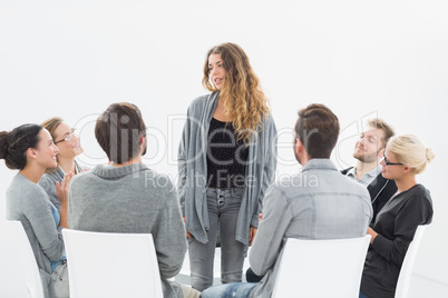 Group therapy in session sitting in a circle