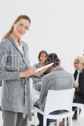 Therapist with group therapy in session