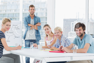 Casual business people around conference table in office