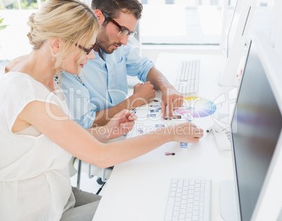 Photo editors working on computers