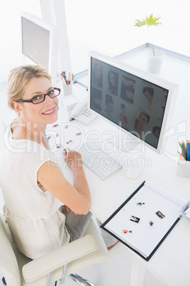 Female photo editor working on computer