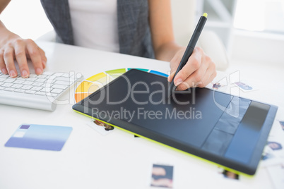 Female photo editor using graphics tablet