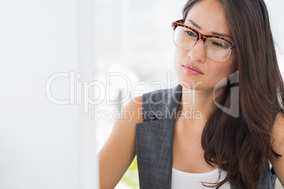 Concentrated young woman using computer