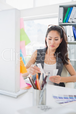 Concentrated female photo editor at work