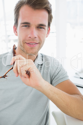 Portrait of a casual male photo editor smiling