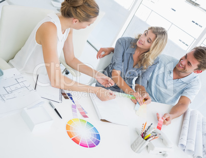 Group of artists working on designs